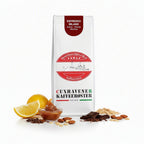 weiße Kaffeetüte des Cuxhavener Kaffeerösters mit der Aufschrift Espresso Milanound Aromasymbolen vor weißem Hintergrund