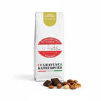 Weiße Kaffeetüte des Cuxhavener Kaffeeroesters mit der Aufschrift Cuxland Barista Crema und Aromasymbolen vor weißem Hintergrund